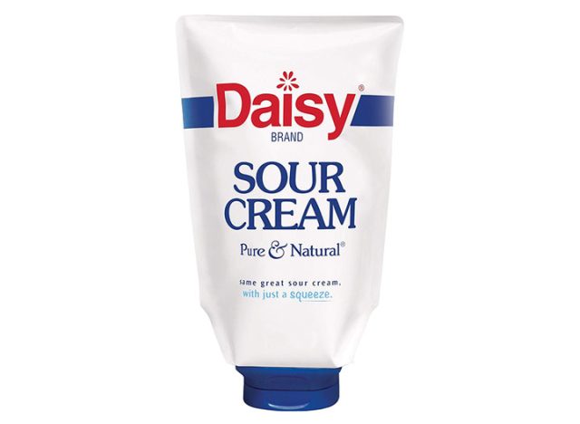 container of Daisy sour cream on a white background