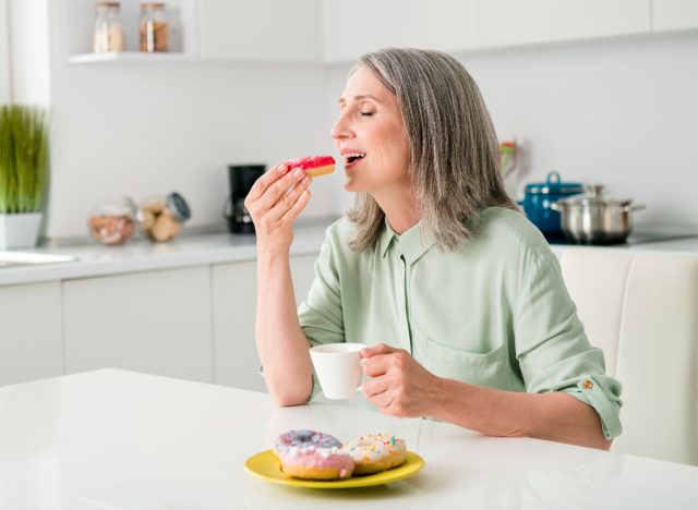 mature woman eating donut, unhealthy lifestyle habits that destroy your back